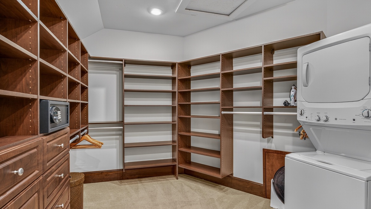 Bedroom 1, Main Level - Primary king bedroom walk in closet with laundry