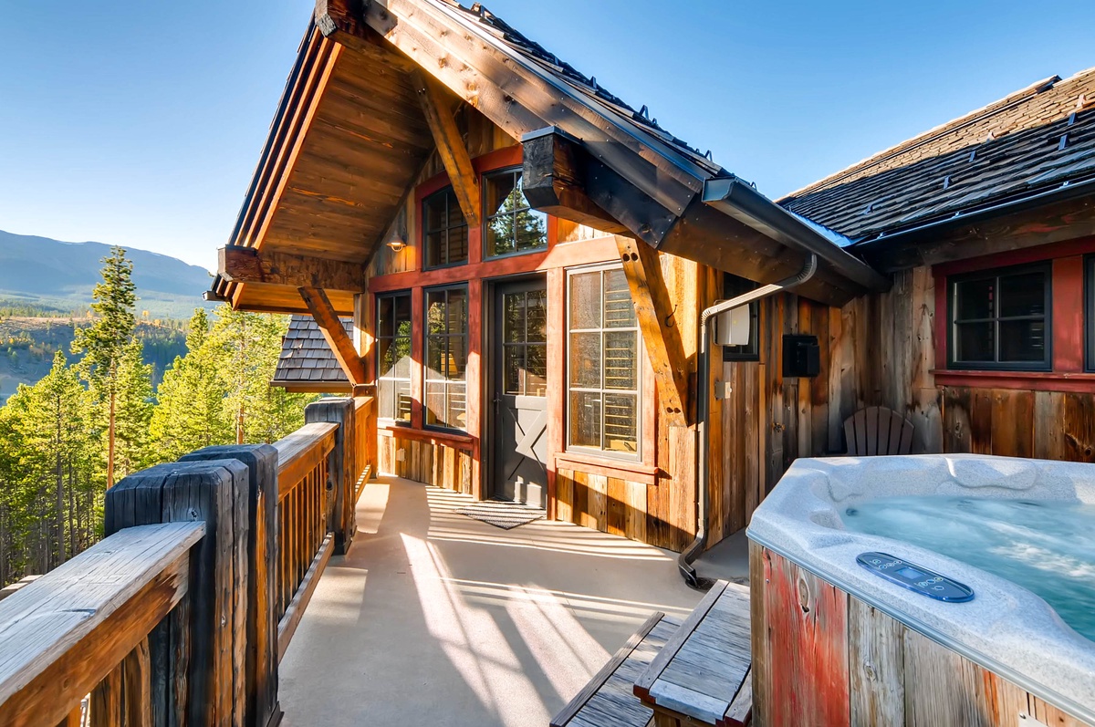 Private balcony with hot tub off upper level primary