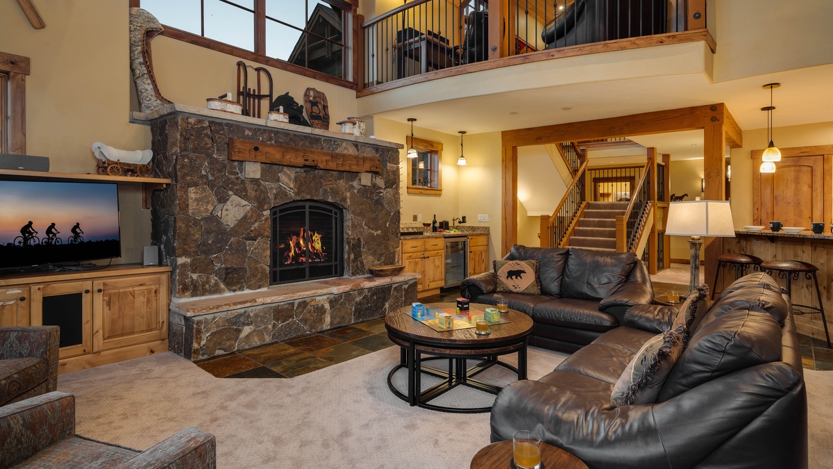 Great room with fireplace, TV and comfortable couches