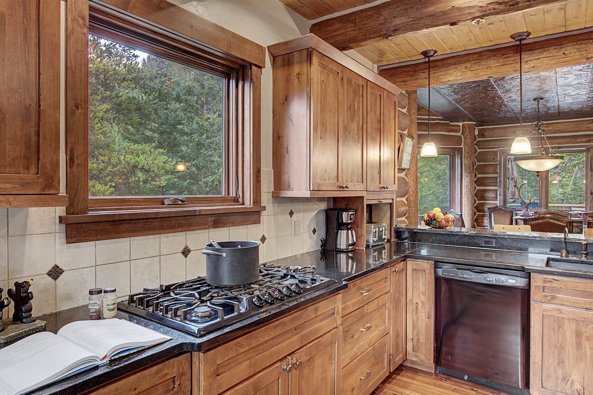 Kitchen, Main Level - Gas cooktop with forest views