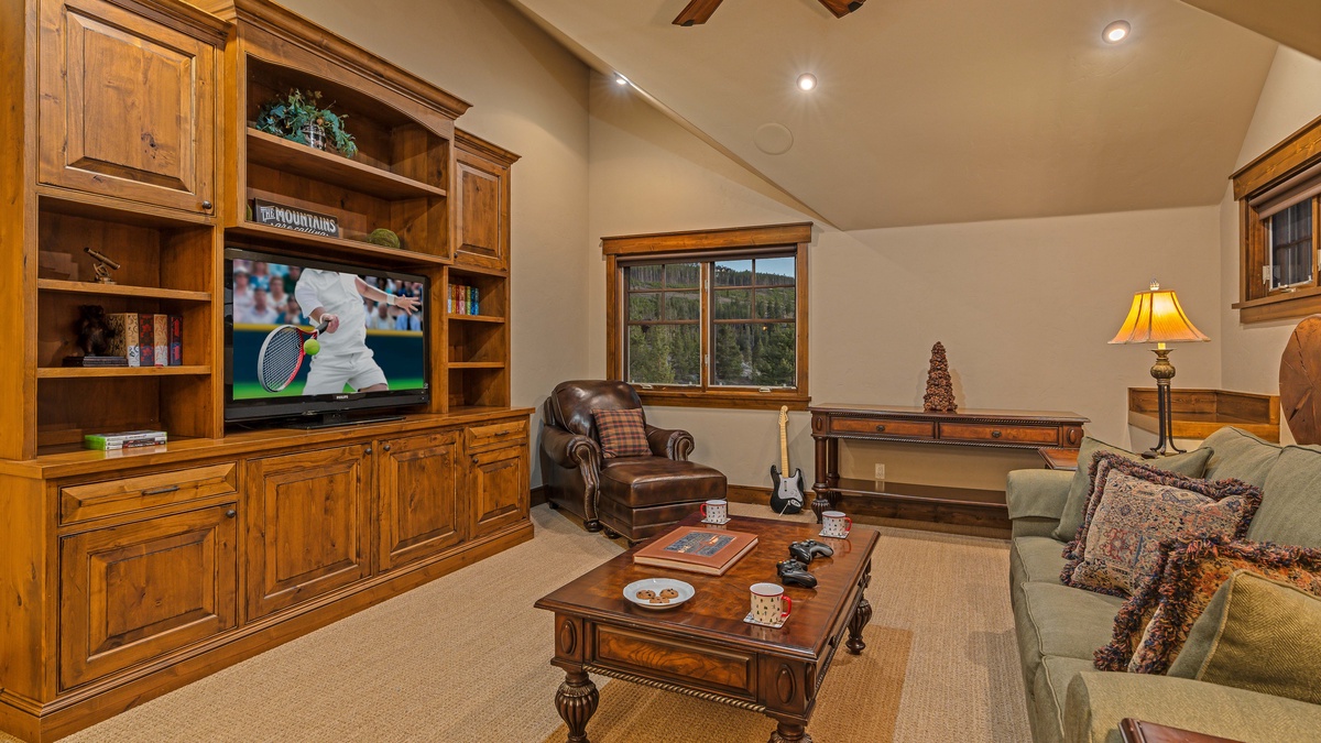 Upper level family room with TV, queen sleeper sofa