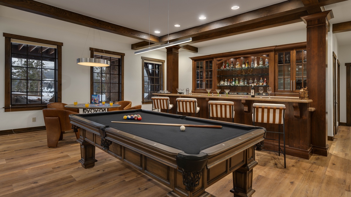 Lower level family room with billiard table and bar