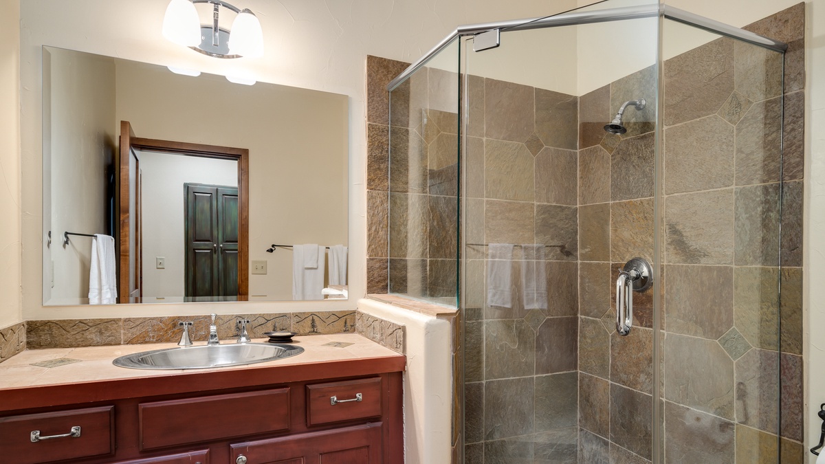 Bathroom with shower off rec room