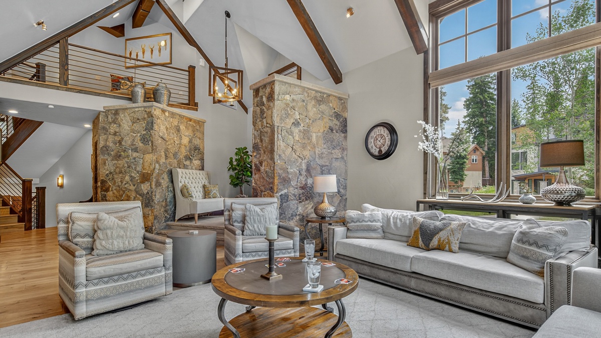 Great Room, Main Level - Comfortable seating area with stone accents and natural light