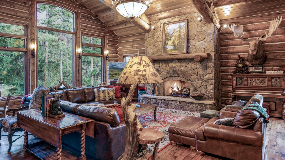 Great Room, Main Level - Seating area beside stone fireplace