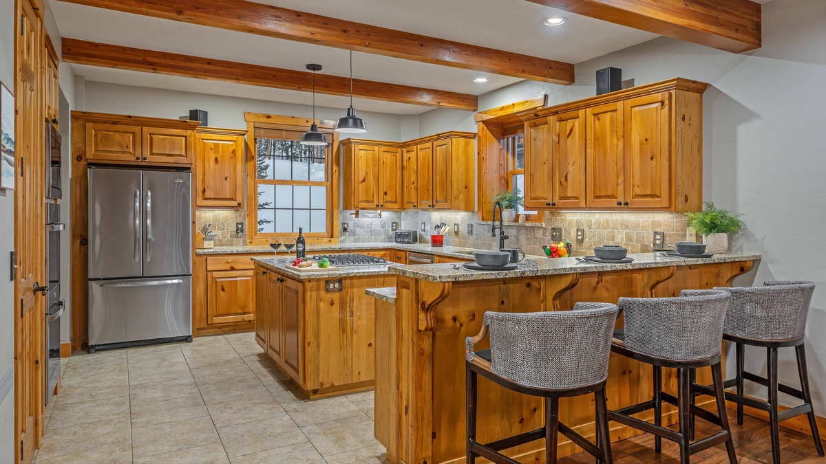 Gourmet kitchen with breakfast bar seating