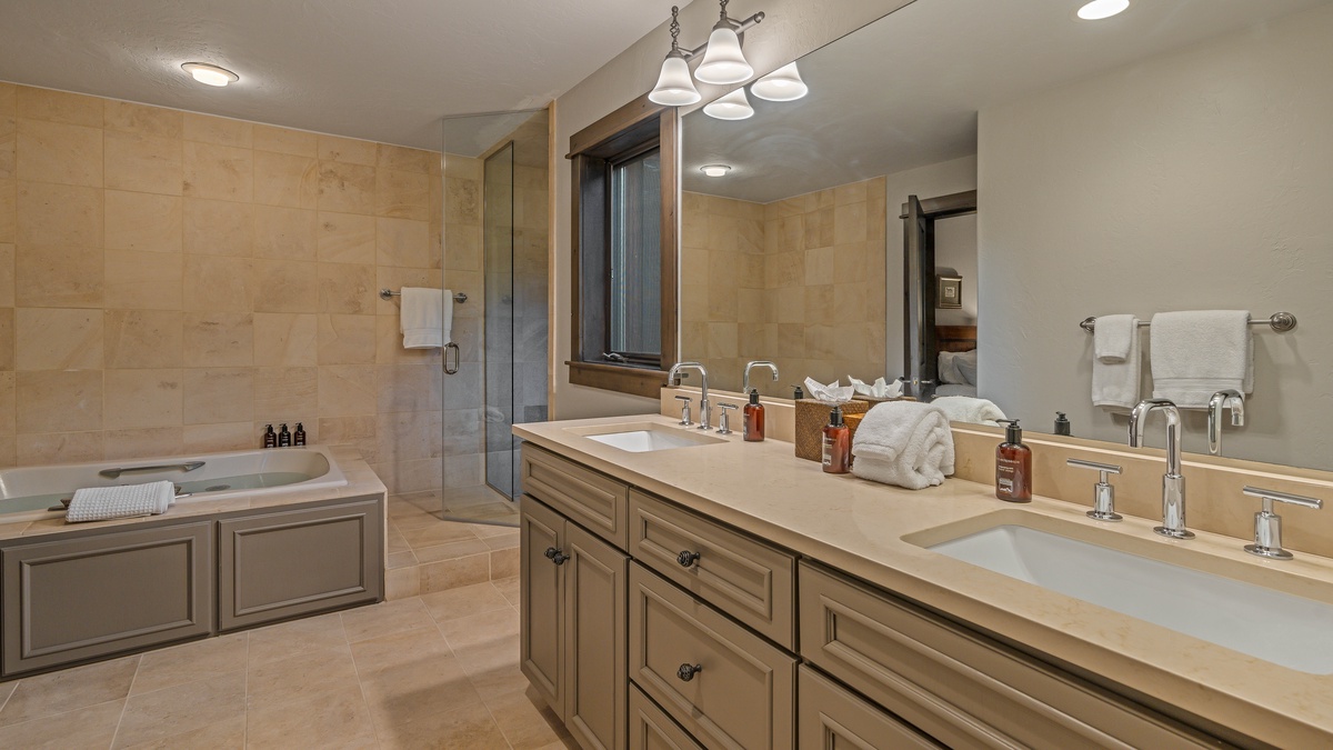 Bedroom 3, Main Level - Twin bed ensuite with soaking tub, shower, and dual vanities