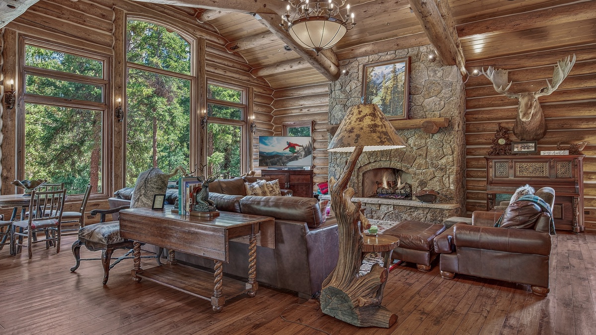 Great Room, Main Level - Seating area beside stone fireplace