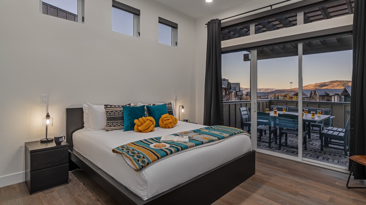 Primary king suite on main level with deck access