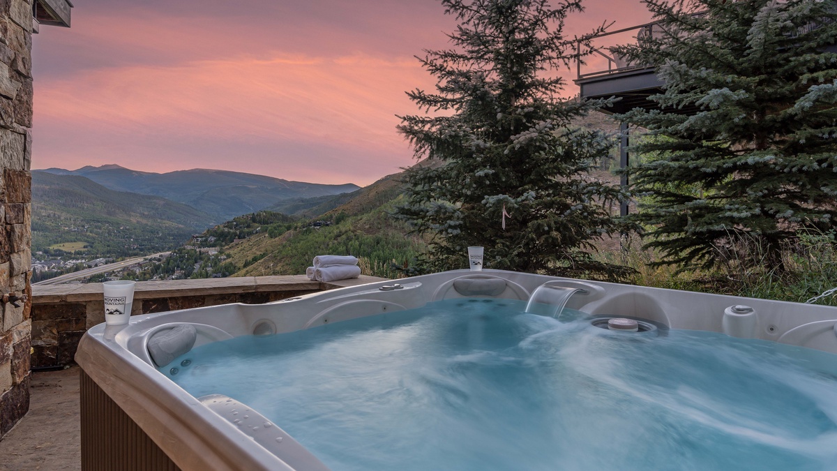 Soak in the private hot tub on the lower level