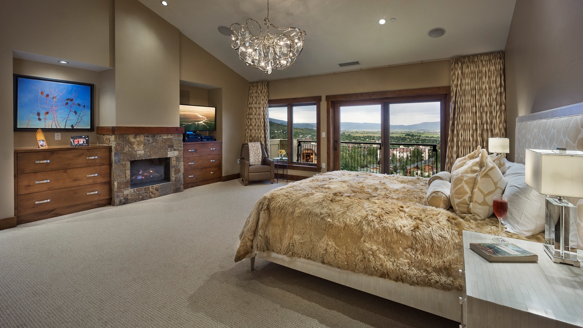 Bedroom 1, Main Level - Primary king suite with fireplace and TV