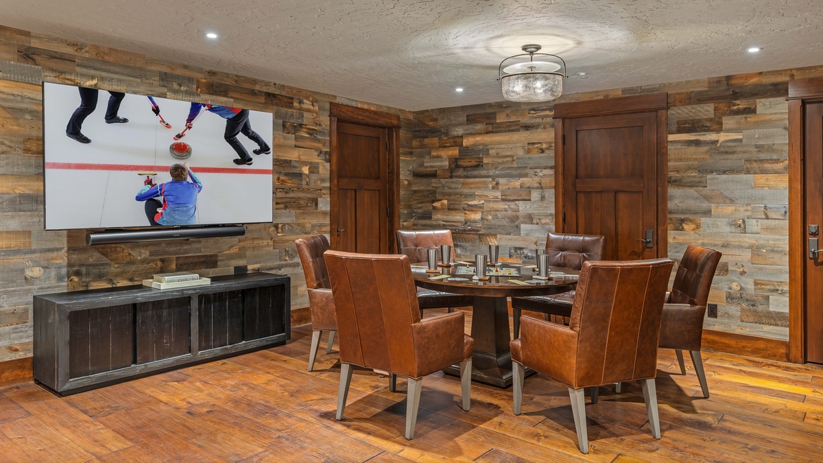 Lower level game room with game table and TV