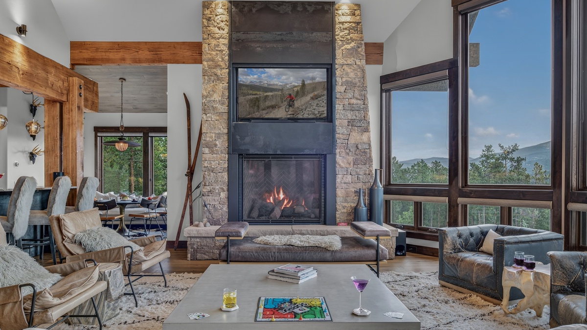 Great Room, Main Level - Seating area with mountain views and a fireplace