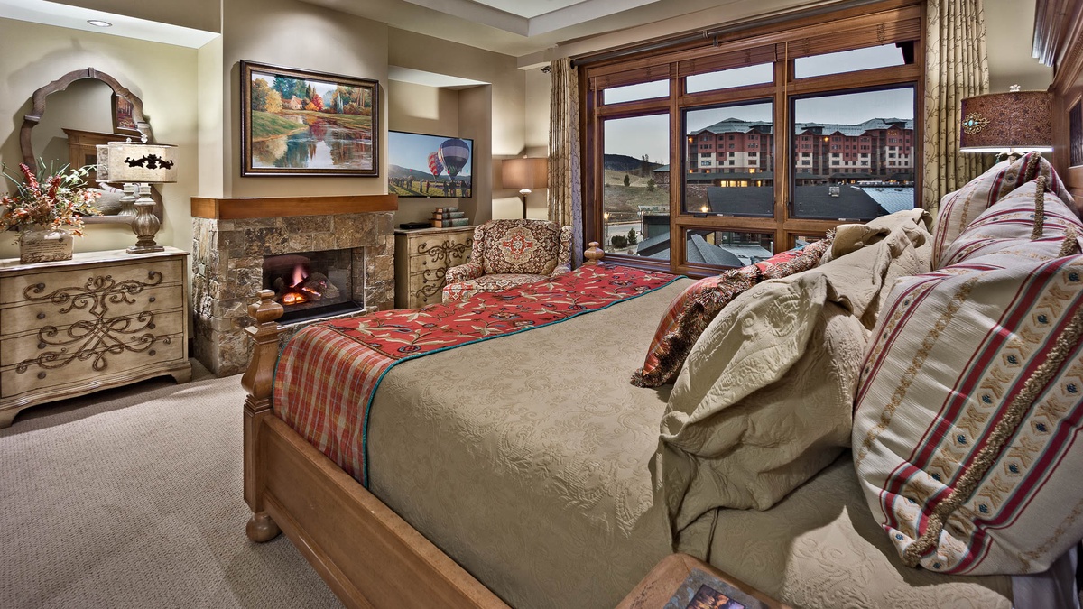 Bedroom 1, Main Level - Primary king suite with fireplace and TV