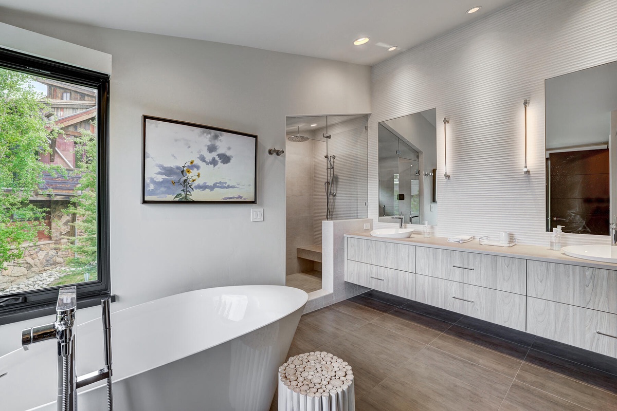 Bathroom 1, Main Level - Primary ensuite with steam shower and tub