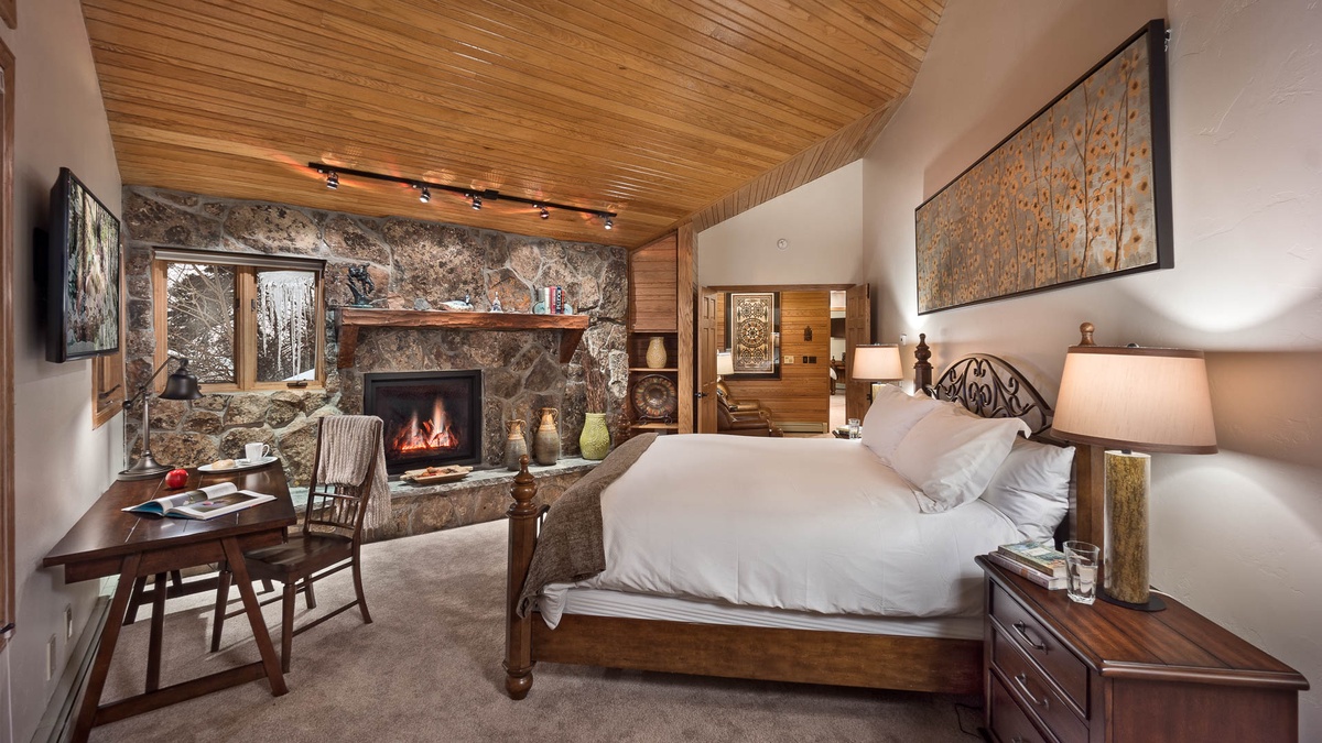 Primary suite with fireplace, deck access