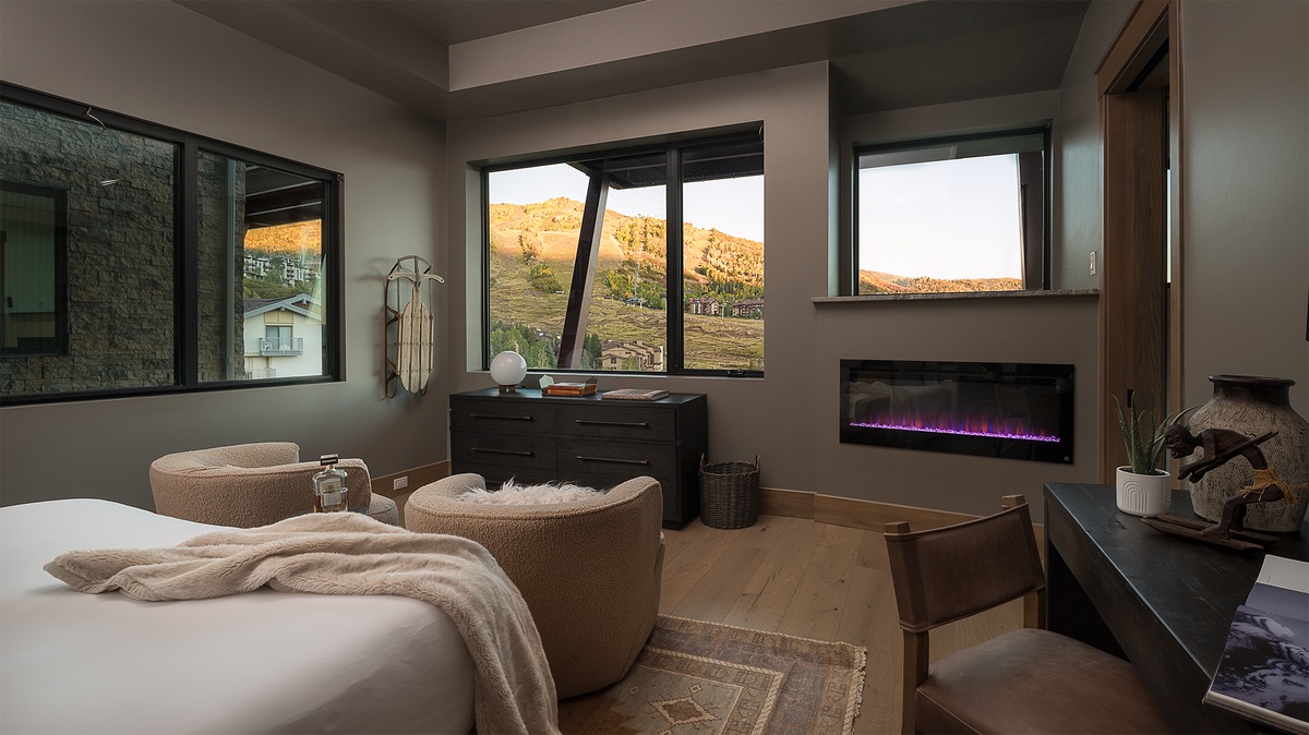 Bedroom 5, Main Level - Aria Ridge, primary king suite featuring fireplace and views