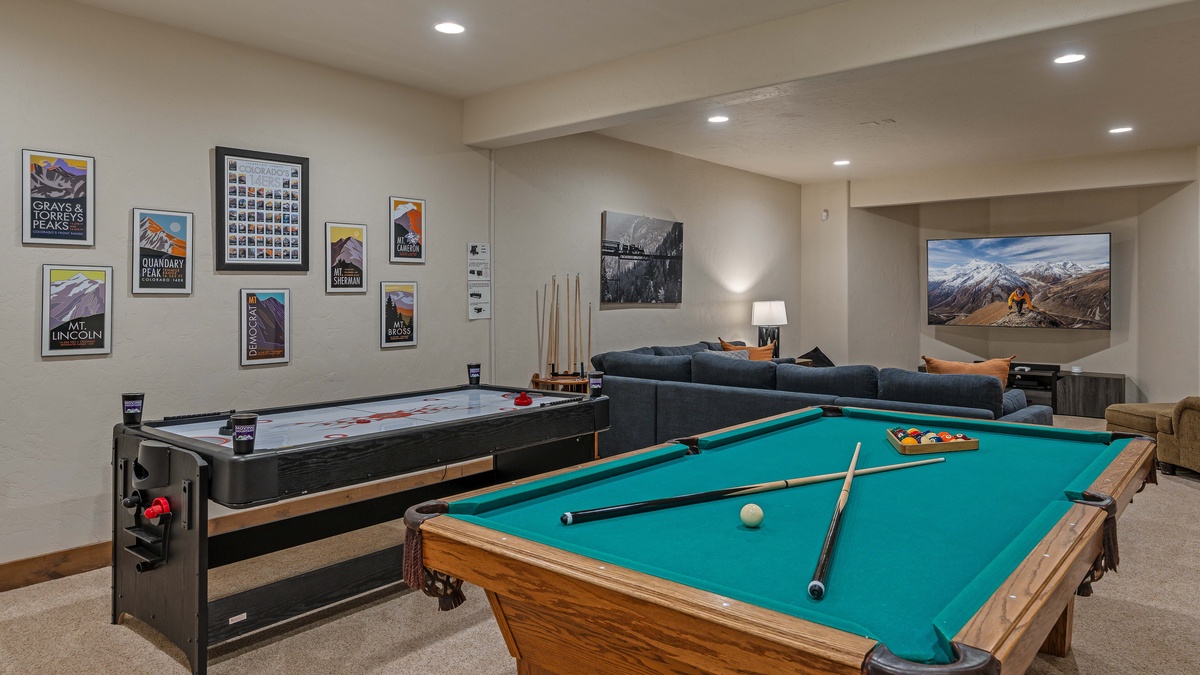 Lower level family room with billiards, ping pong, and air hockey