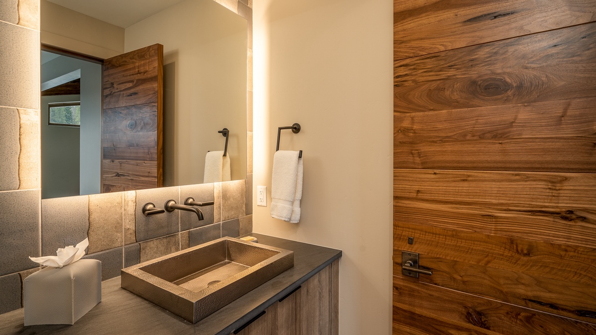 powder bath adjacent to wet bar on upper level