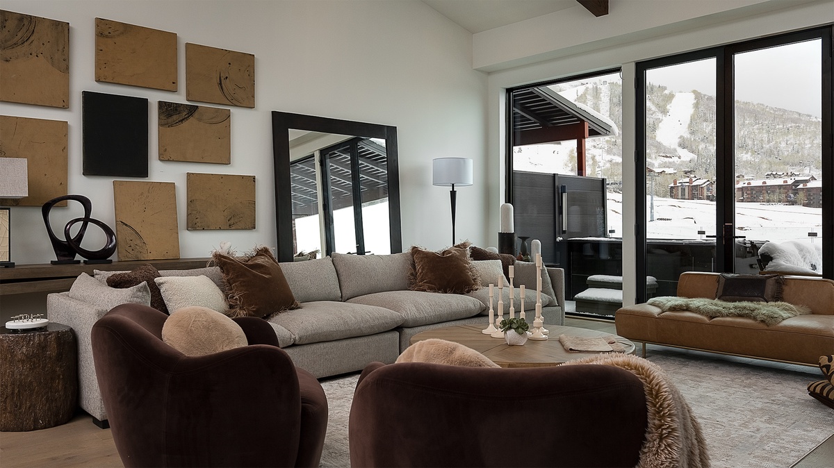 Great Room, Upper Level - Seating area with sofa and deck access