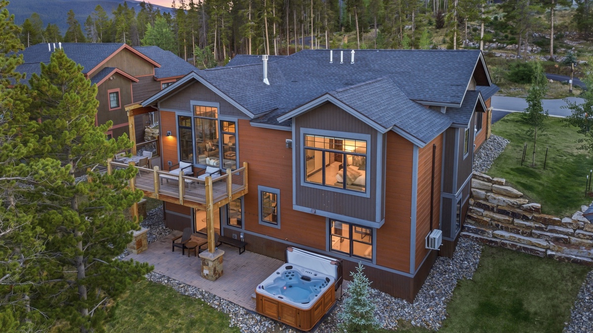 Exterior - Rear exterior view with hot tub and deck