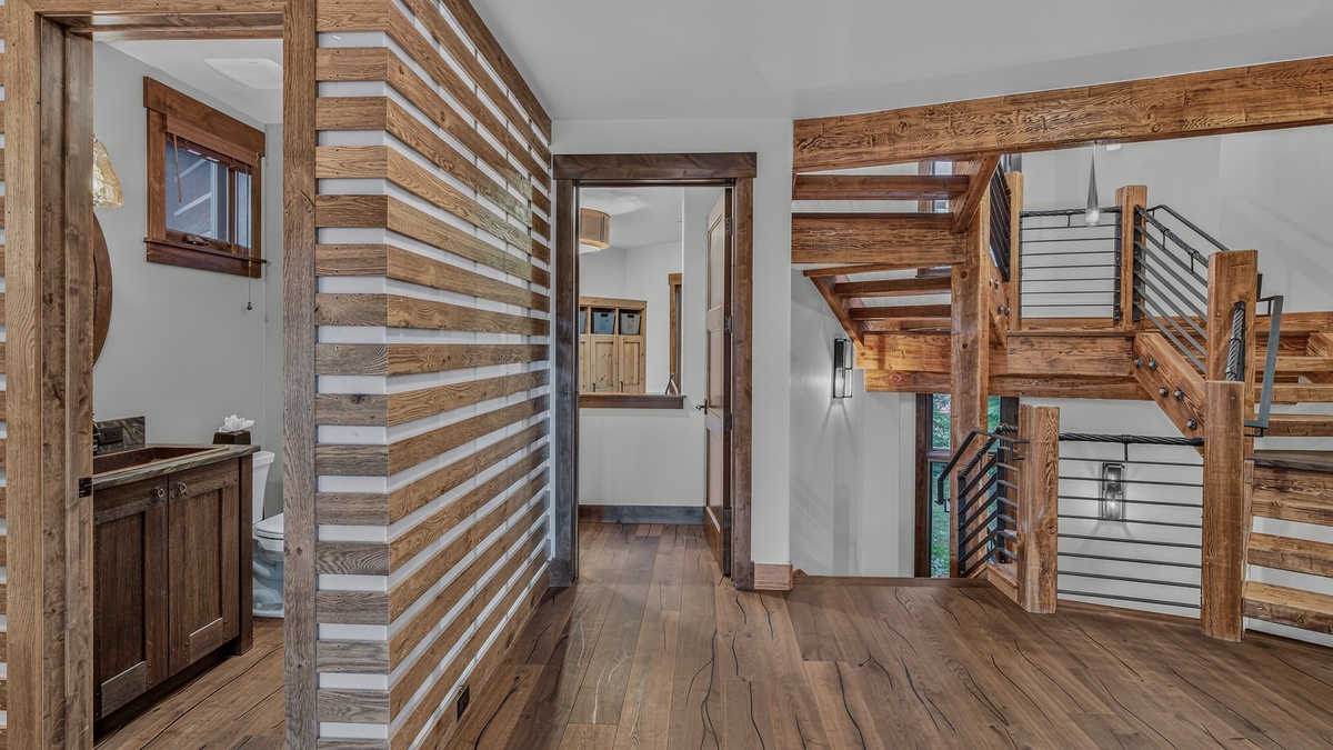 Stairs and Hallway, Main Level - Staircase with wood and metal railing
