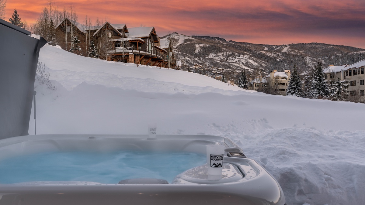Hot Tub, Main Level Patio - Relax in the hot tub with snowy resort mountain views.