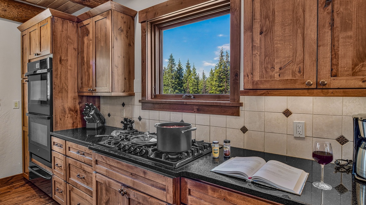 Kitchen, Main Level - Gas cooktop with forest views