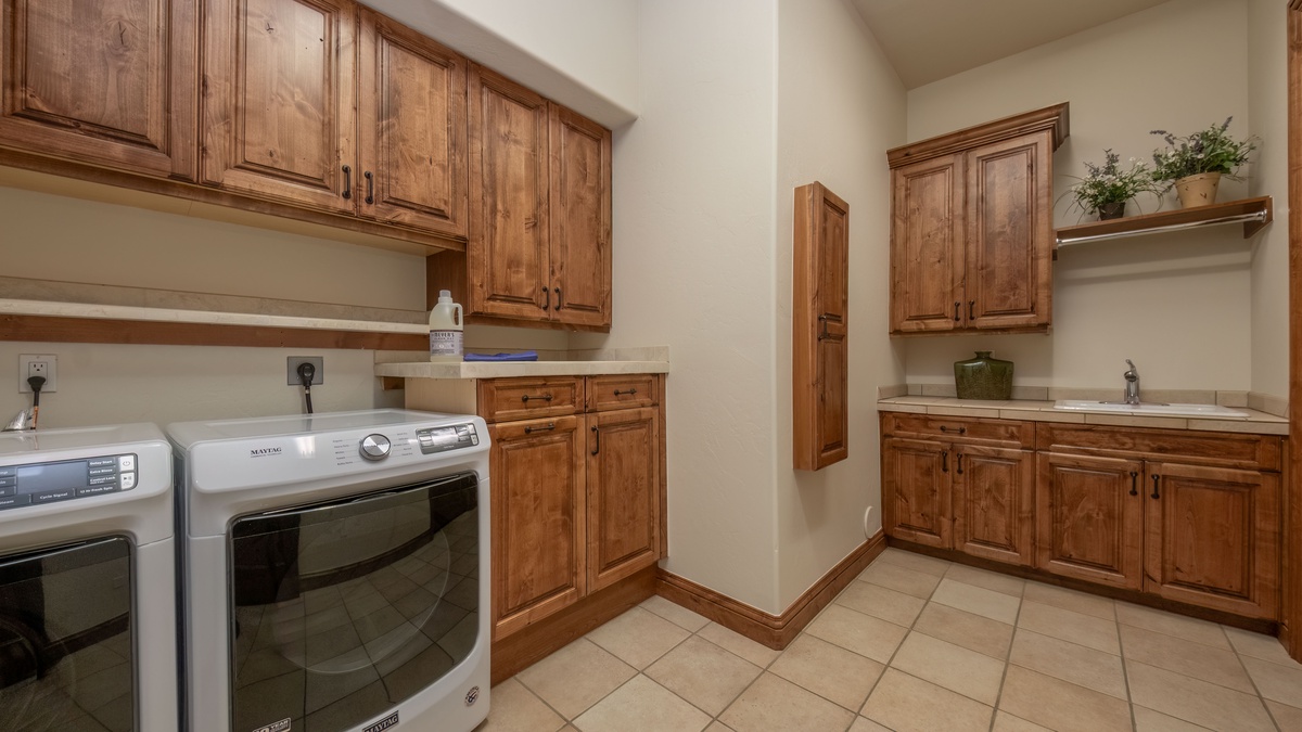 Laundry Room, Lower Level - Dedicated laundry space with washer and dryer