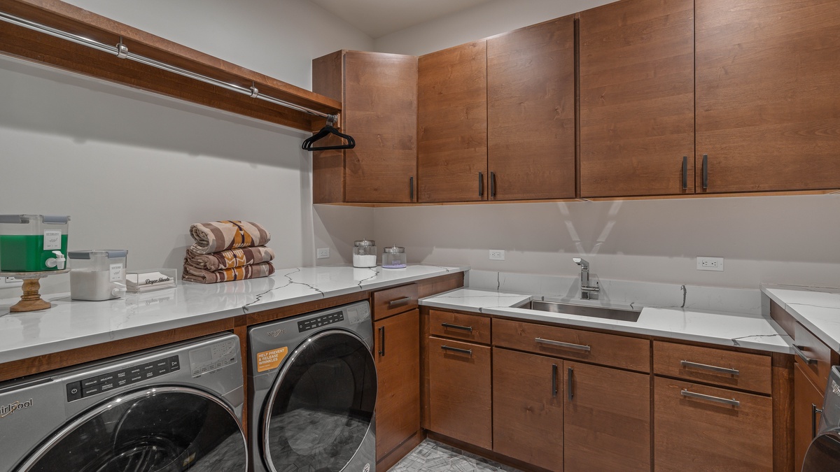Laundry room with 2 washers and 2 dryers on main level