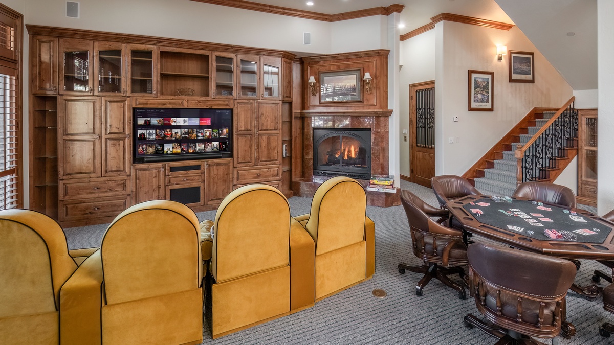 Entertainment Room, Lower Level - Theater seating with poker table and built-in cabinetry