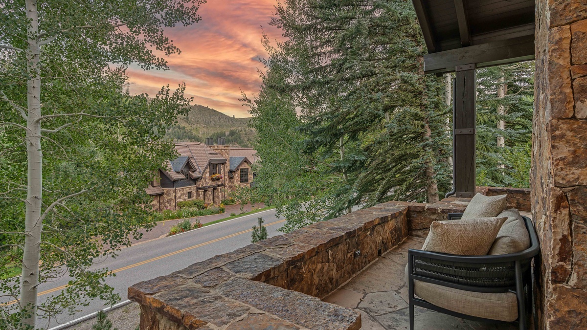 Cozy balcony seating around the corner from the main patio
