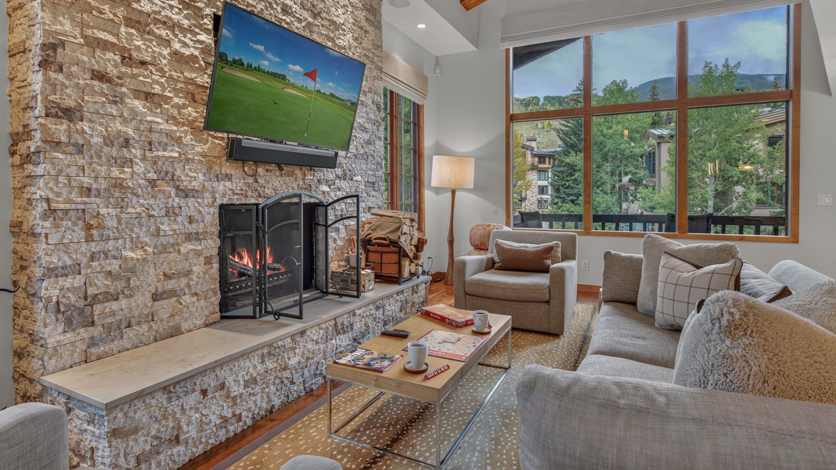 Great Room, Main Level - Seating area with fireplace and TV