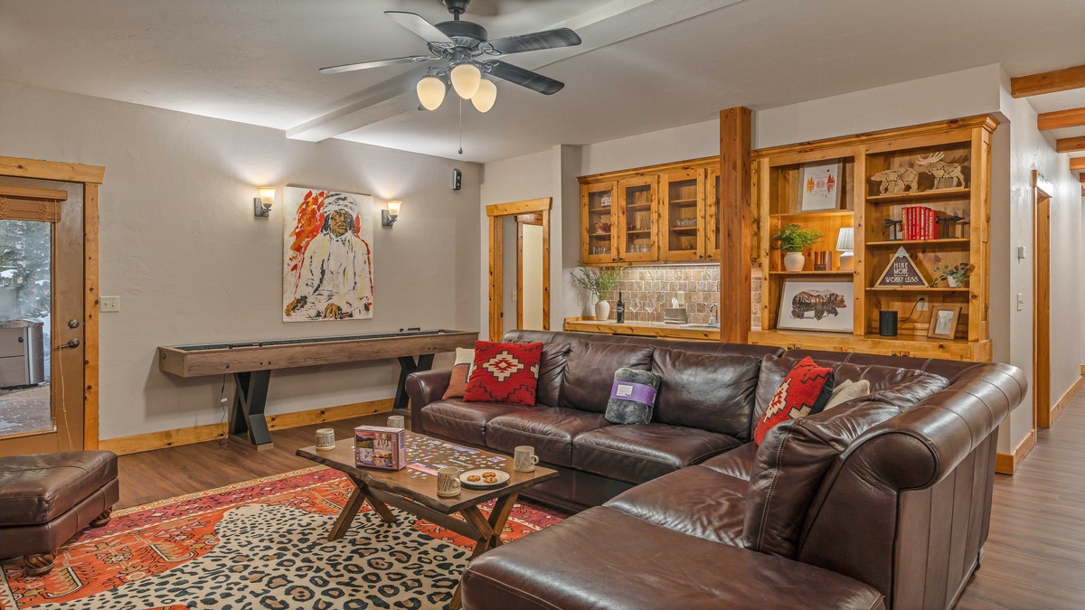 Family room with shuffleboard and hot tub access