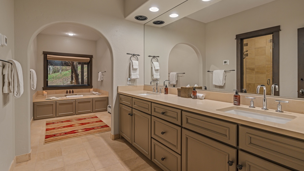 Bedroom 4, Lower Level - King ensuite with soaking tub, shower, and dual vanities