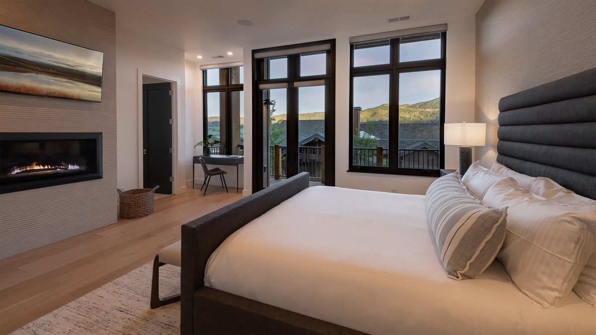 Bedroom 1, Upper Level - Primary king bed with windows and desk