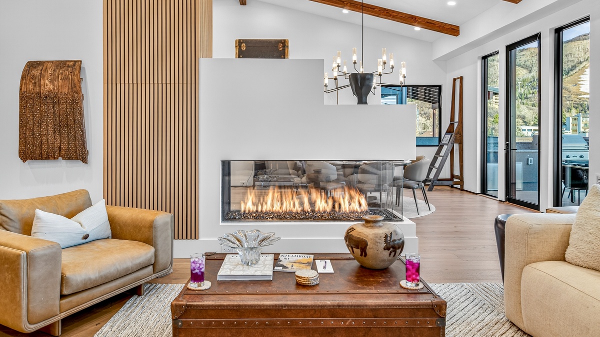 Great Room, Upper Level - Three-sided, glass-walled fireplace