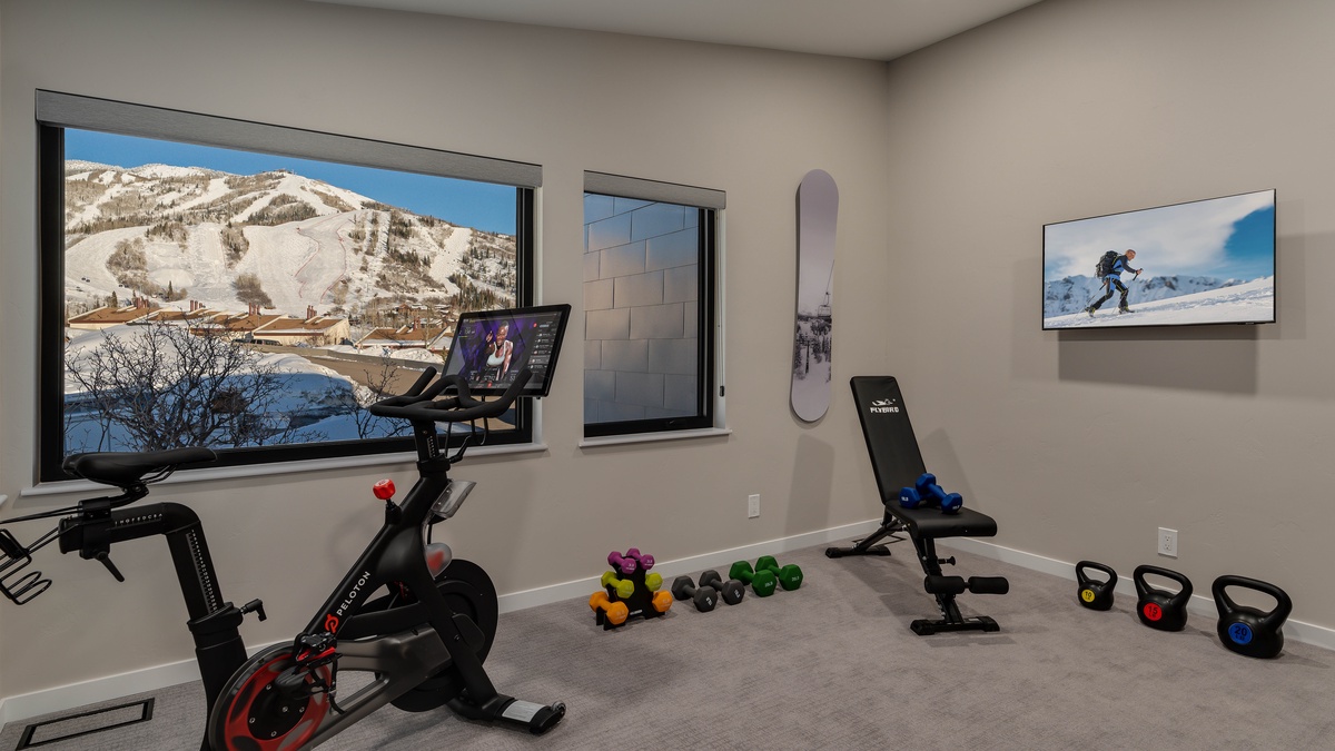 Fold up the Murphy bed and bring out the weights to create a fitness room