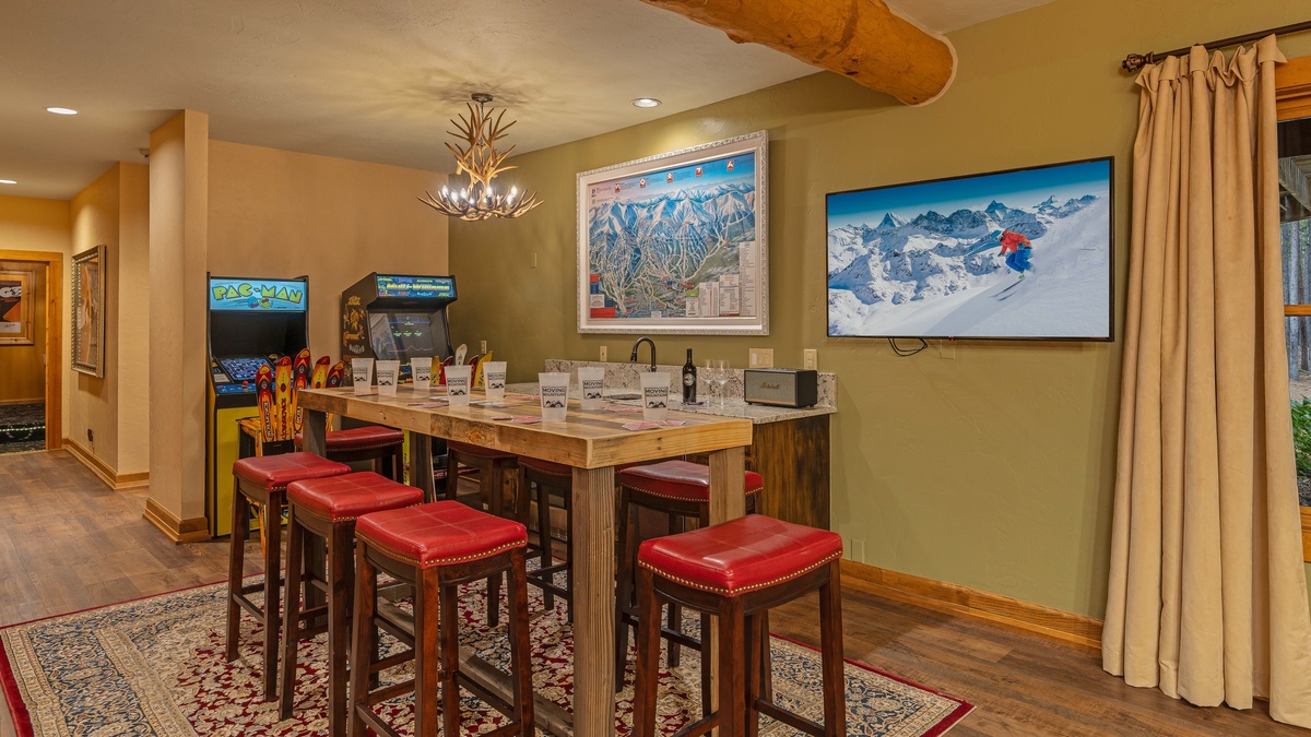 Family room on lower level with bar and arcade games