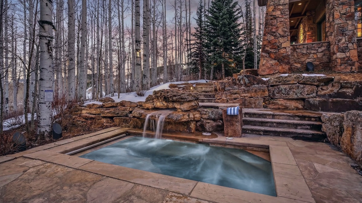 Hot Tub, Lower Level Patio - In ground hot tub with surrounding patio seating and peaceful wooded setting