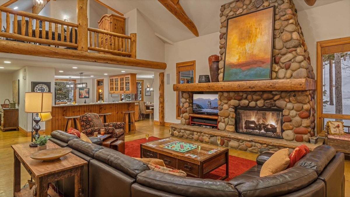 Spacious great room with fireplace and TV