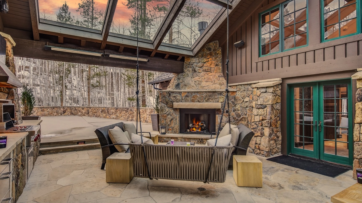 Patio, Lower Level - Covered outdoor seating area with fireplace