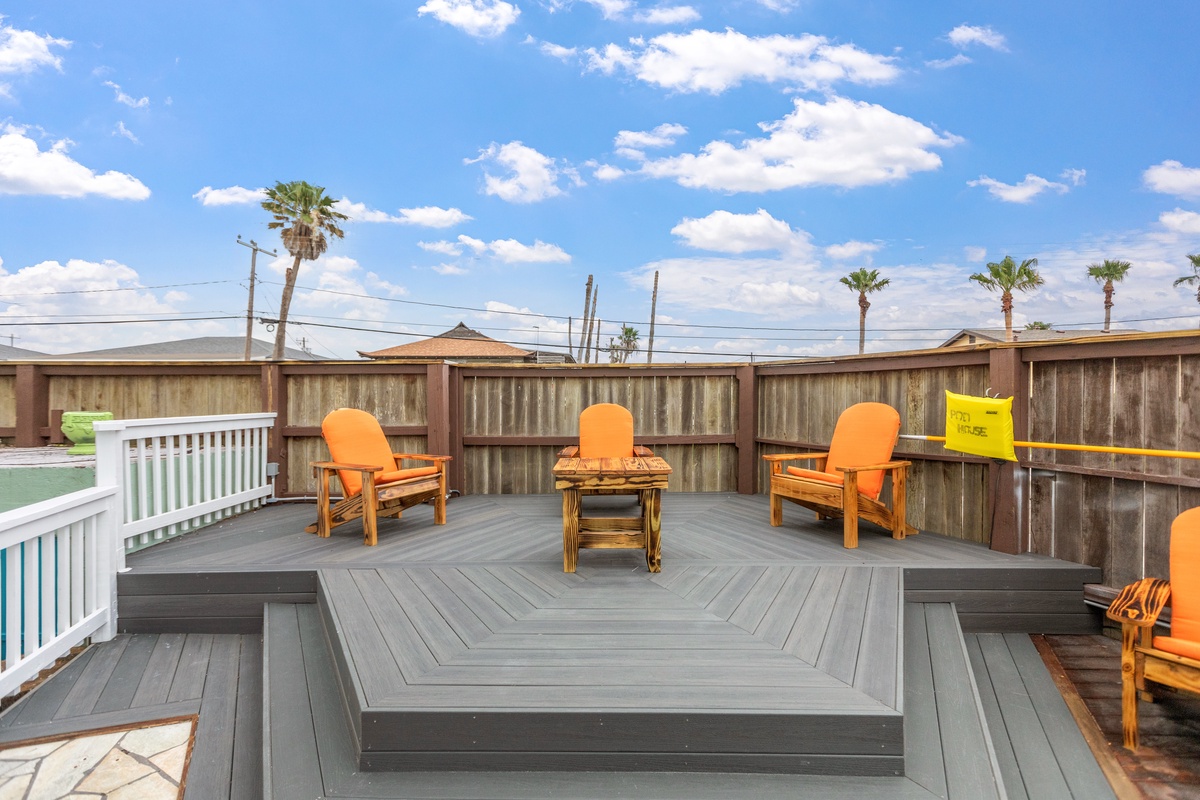 Relax in your private rooftop terrace with comfortable seating and panoramic views of swaying palm trees.