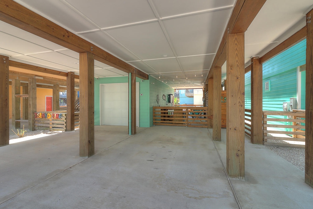 Spacious covered parking area with sturdy wooden beam construction provides secure shelter for your vehicle during your stay.
