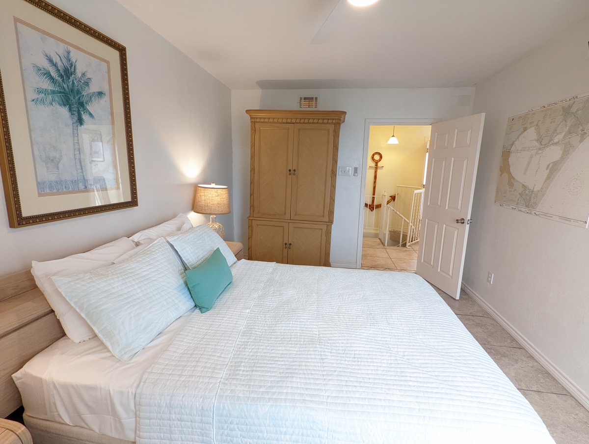 Drift off to sleep in your serene bedroom with tropical art and spacious wardrobe for all your belongings.