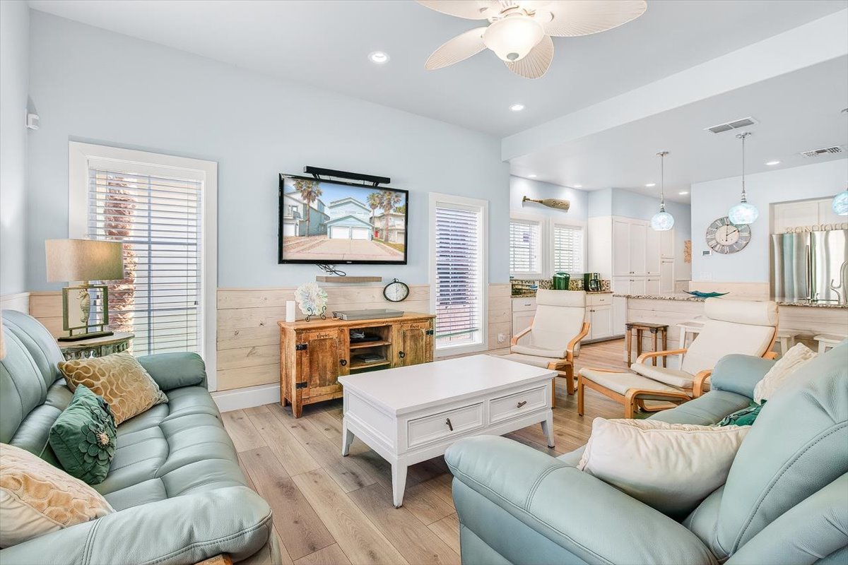 Unwind in your serene coastal retreat where soft mint furnishings and warm wood create the perfect blend of comfort and style.