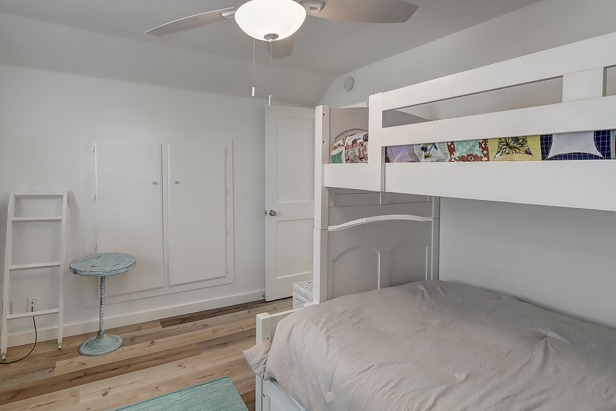 Your family will love this cozy bunk bed room with ceiling fan and plenty of storage space for clothes and belongings.