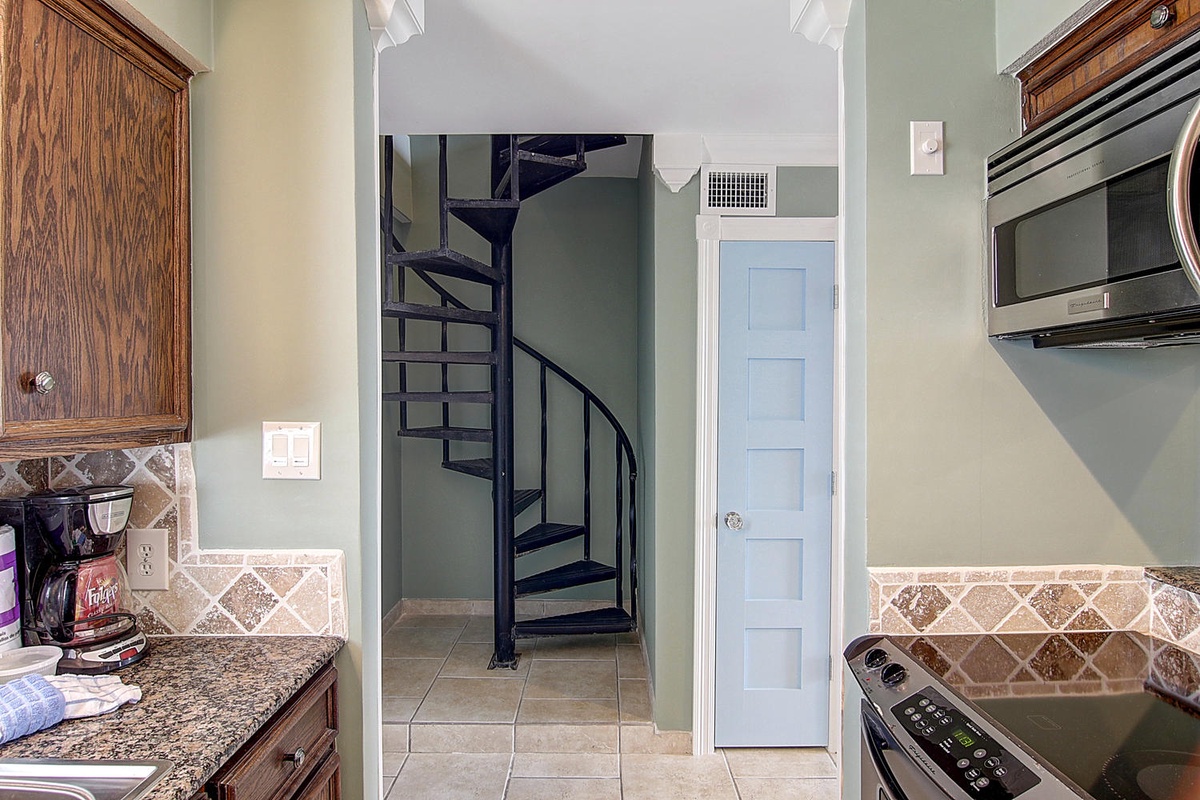 Your fully equipped kitchen features granite counters, stainless steel appliances, and elegant wood cabinetry for memorable meal preparations.