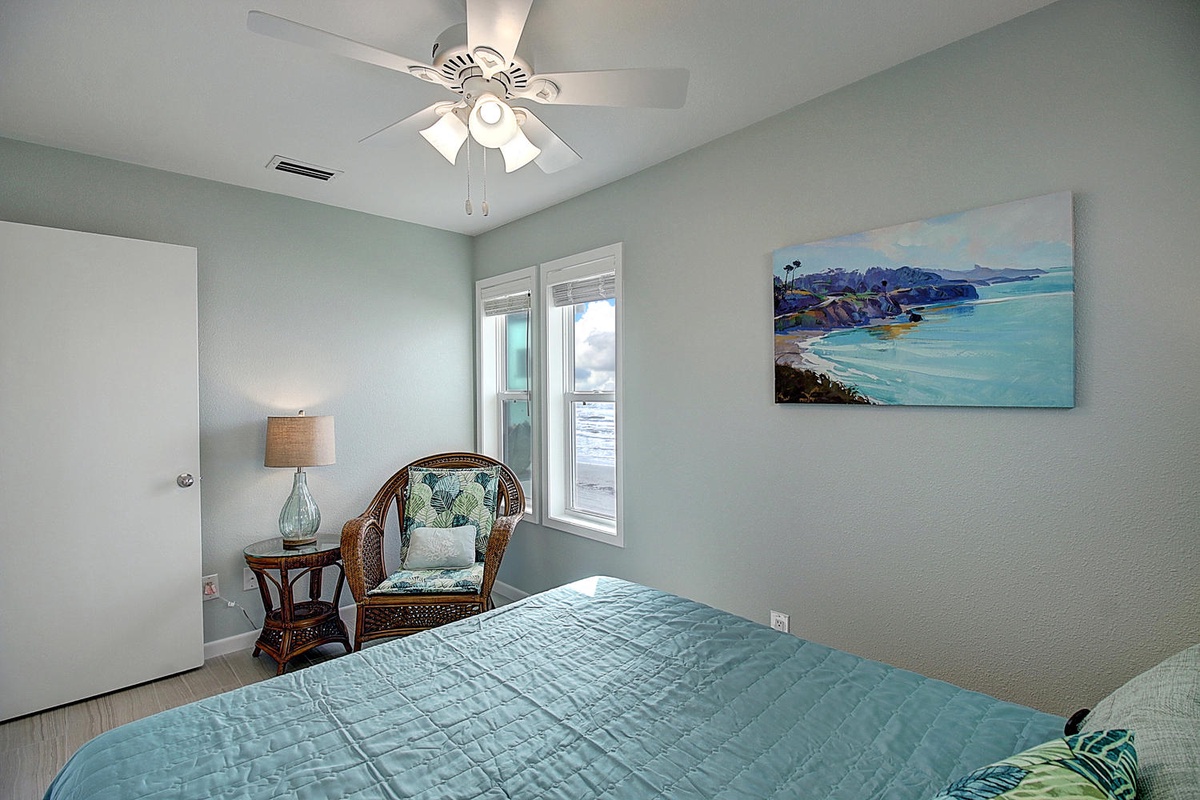 Unwind in your serene coastal bedroom where soft sea-inspired colors and the cozy reading chair create your perfect retreat.