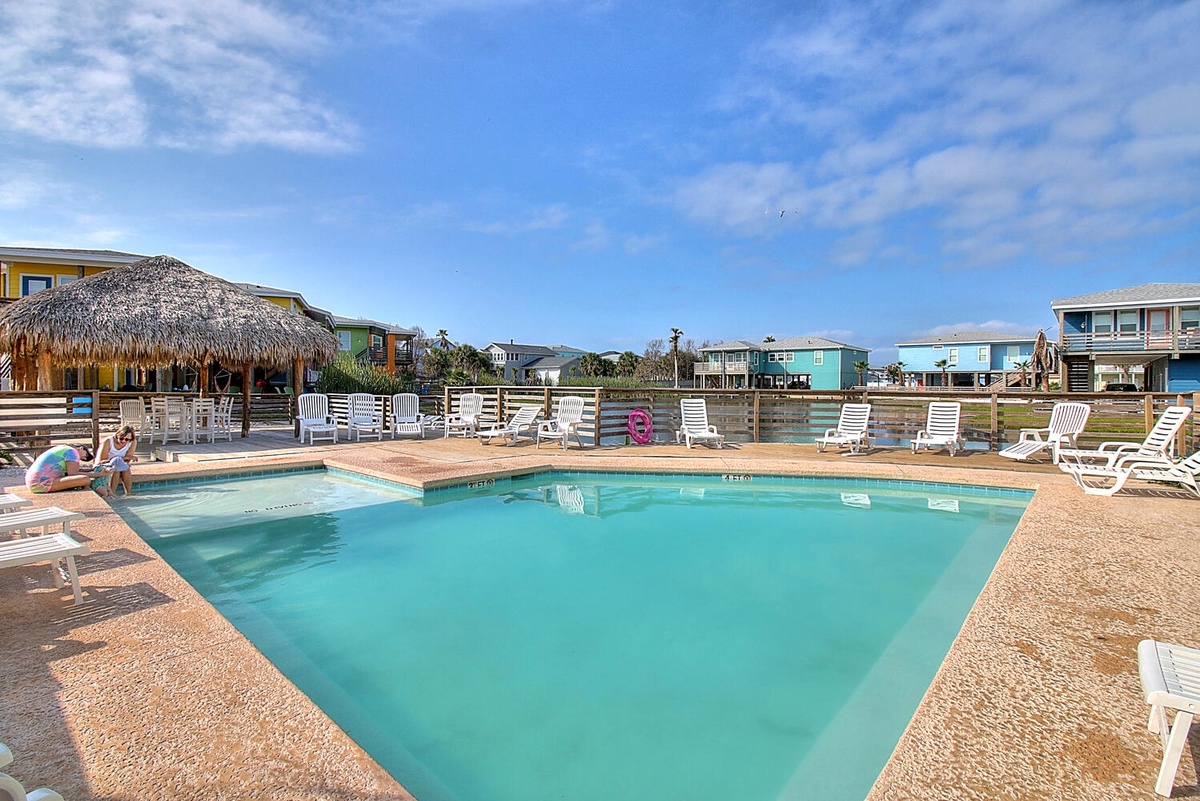 Dive into crystal-clear waters while soaking up coastal vibes. Your perfect poolside retreat awaits with comfortable loungers and tropical charm.